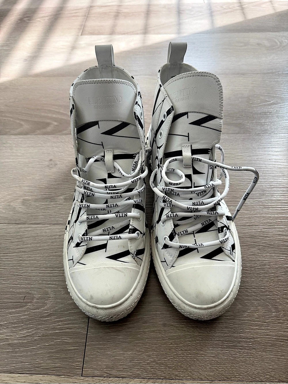 Valentino High-Top Sneakers in White & Black